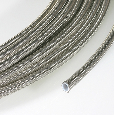 Click to enlarge - Extruded smooth bore PTFE hose reinforced by a stainless steel overbraid. Designed for use with most industrial gases, chemicals, adhesives, steam, etc. Offers good flexibility and high working temperatures.